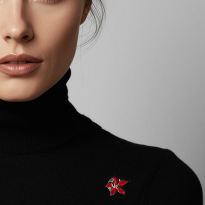 Close-up of a person wearing a black turtleneck with a red brooch on a gray background